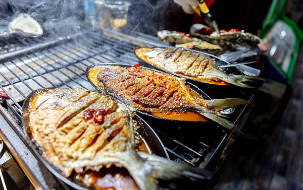 Grilled fish with chili peppers in the making
