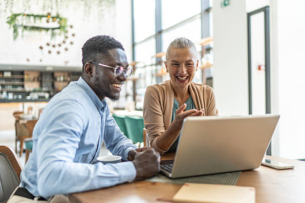 istock Business people having a video call in a restaurant 2233486723