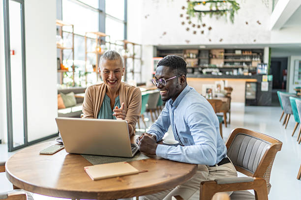 istock Business people having a video call in a cafe 2233486729