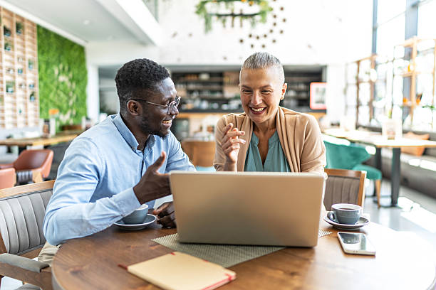 istock Business people having a video call in a cafe 2233486769