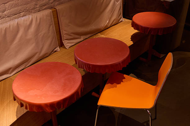 istock A Stylish Cafe with EyeCatching Seating Featuring Vibrant Tables and Charming Chairs 2233486809