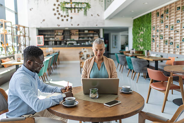 istock Business people working on a project in a cafe 2233486840