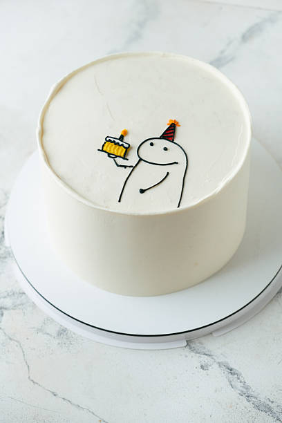 istock Birthday cake with funny meme drawing on the white marble background 2233487194