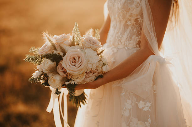 istock Bride holding a beautiful bouquet 2233487387
