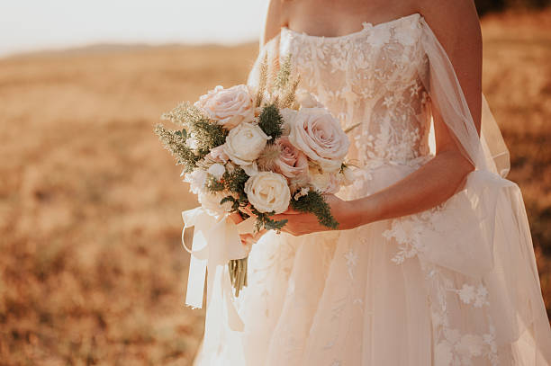 istock Bride holding a beautiful bouquet 2233487389