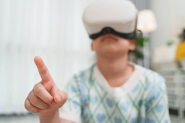 Child wearing VR headset gesturing in virtual world. Concept of immersive learning, playful education, entertainment, and interactive technology for kids.