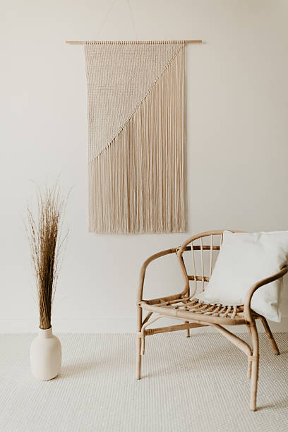 istock Minimal Boho Interior with Raffia Chair and Wall Hanging 2233493841
