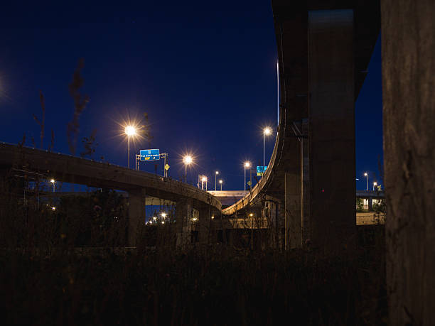 istock Modern Concrete Overpasses and Railway Tracks at Night 2233494188