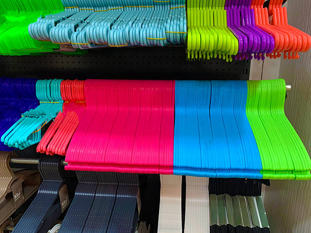 istock Hangers in different colors on display 2233494197
