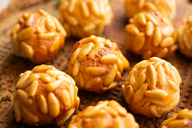 istock Panellets with pine nuts and almonds. A typical Catalan dessert made with marzipan and nuts. 2233494457