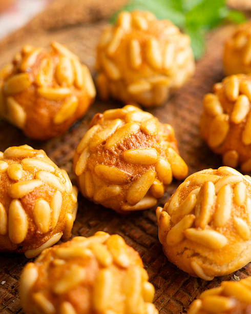 istock Panellets with pine nuts and almonds. A typical Catalan dessert made with marzipan and nuts. 2233494481
