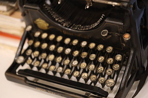 istock A classic vintage typewriter placed on a wooden table, ready for use 2233497963