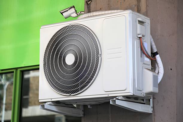 istock Air conditioner on building wall in Italy 2233499813