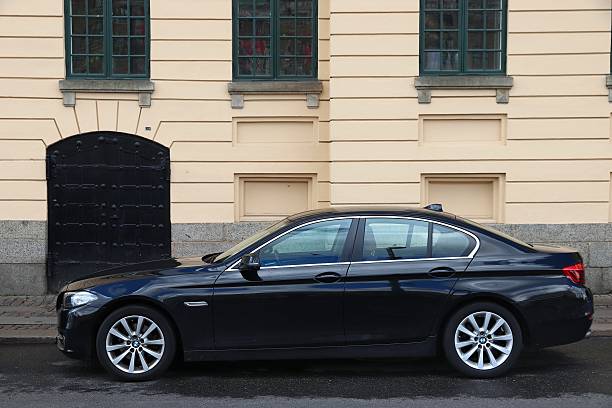 BMW 5 series (F10) executive car parked in Gothenburg, Sweden. There are 4.8 million passenger cars registered in Sweden.