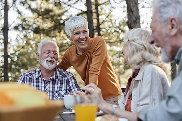 istock Happy senior couples enjoying in conversation on a patio. 2233502465