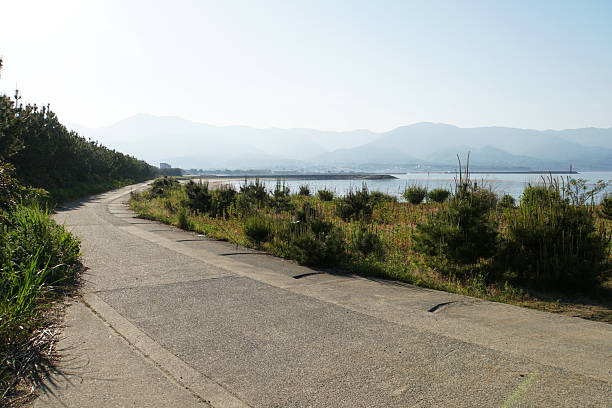 istock Scenic seaside trail facing calm ocean horizon 2233502669