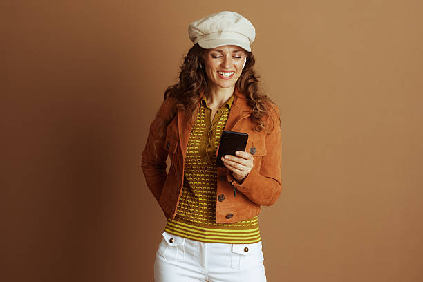 istock Happy Woman Using Smartphone with Earbuds 2233504686
