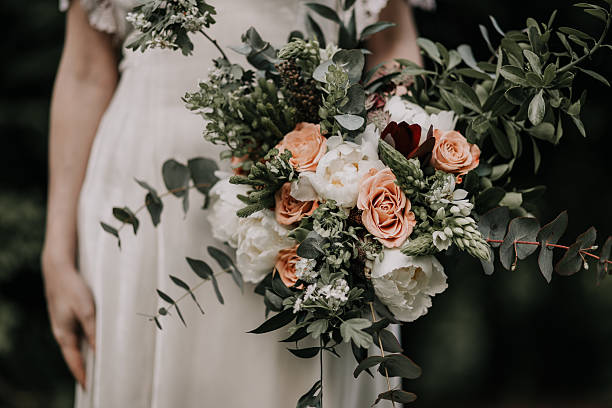 istock Close-Up of Bride with Romantic Wedding Bouquet 2233506271