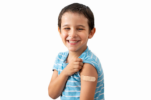 istock Happy child with plaster after vaccine 2233507117