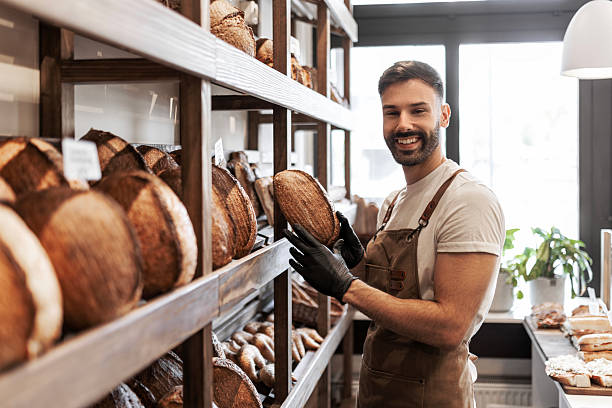 istock Confident man working in bakery shop looking at camera 2233507206