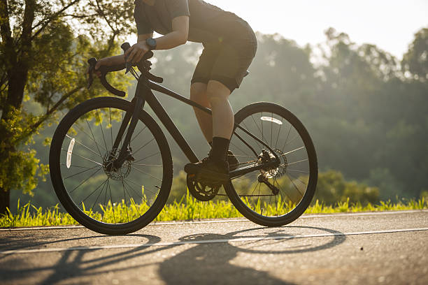 istock Cyclist riding bike at summer park 2233509993