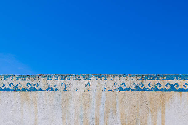 istock Faded blue and white geometric wall pattern outdoors 2233513968