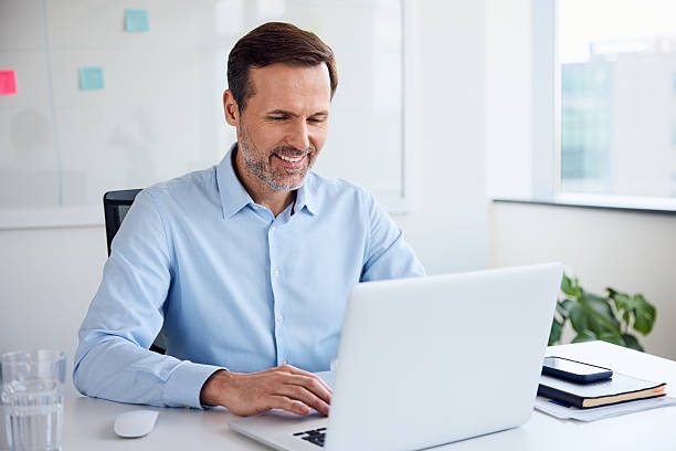istock Businessman working on laptop at office 2233518518