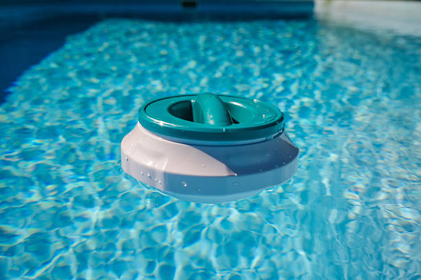 istock Floating pool chlorinator on clear blue water surface, used for chemical disinfection and regular pool care 2233519080