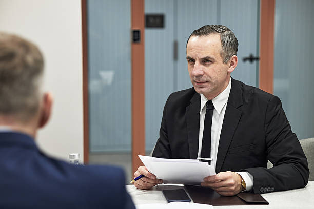 istock Executive Conducting Job Interview with Male Candidate 2233519238