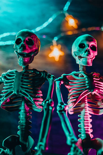 istock Two Skeletons with Neon Lights for Halloween 2233519252