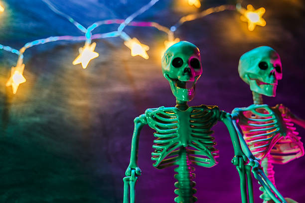 istock Two Skeletons with Neon Lights  with Starry Lights for Halloween. 2233519258