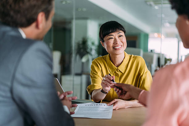 istock Business people signing a contract in the office. 2233519878