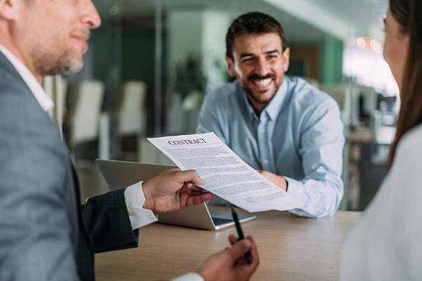 istock Business people signing a contract in the office. 2233519890