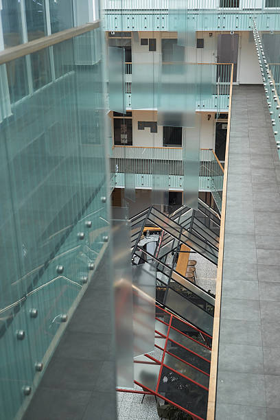 istock Modern Office Building with Glass Walls and Spacious Atrium 2233520274