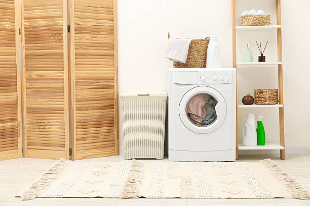 istock Wicker laundry baskets, washing machine and detergent in bathroom 2233520348