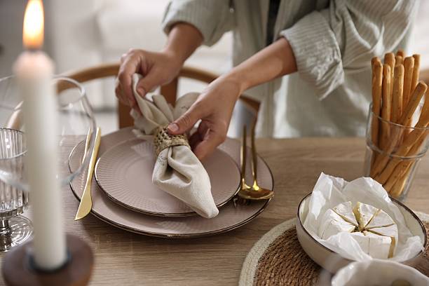 istock Woman setting table for dinner at home, closeup 2233521411
