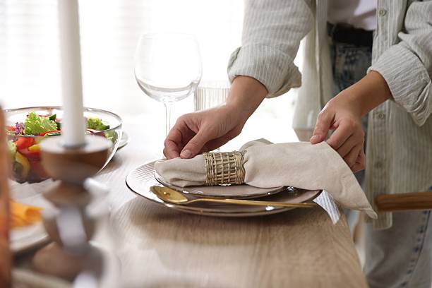 istock Woman setting table for dinner at home, closeup 2233521431