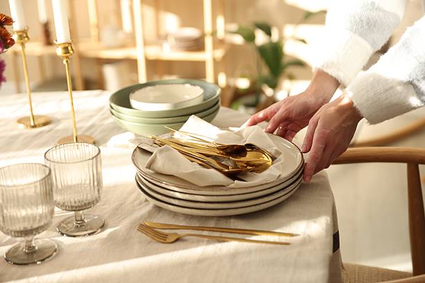 istock Woman setting table for dinner at home, closeup 2233521549
