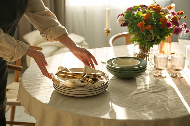 istock Woman setting table for dinner at home, closeup 2233521626