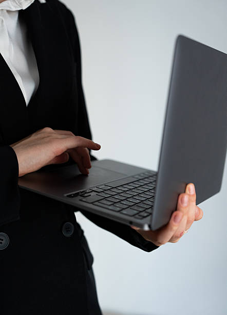 istock Professional woman holding laptop isolated 2233521963