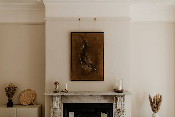 istock Warm minimalist interior with abstract artwork and victorian marble fireplace 2233522006