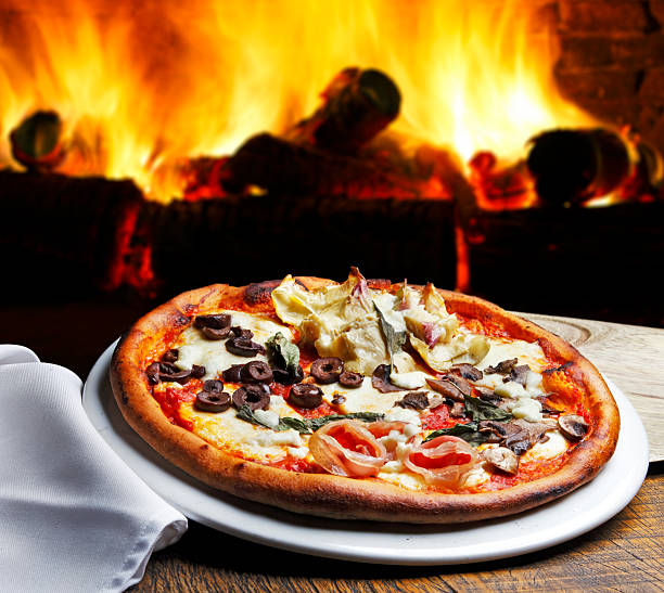 istock Pizza baked in a wood-fired oven 2233522321