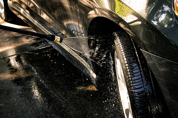 istock a car being washed with a high-pressure washer., demonstrating motion and water. droplets and spray are in the air. automotive, lifestyles, and industry design element 2233523708