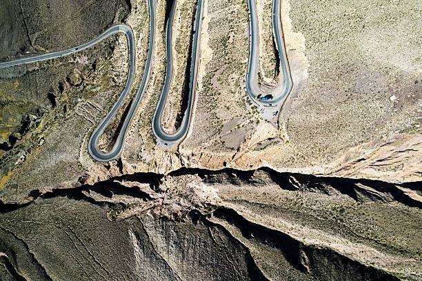 istock Winding asphalt road climbing mountain, Purmamarca, Argentina 2233523846
