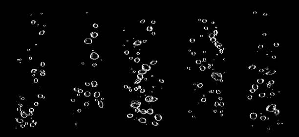 istock Clear water bubbles rising underwater on black background, abstract texture symbolizing freshness, purity, beverage, soda, mineral water, spa, and wellness, perfect for advertising, design backgrounds 2233524784