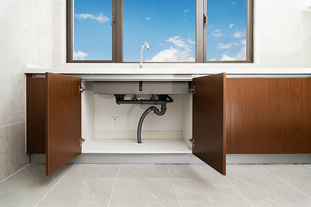 istock Front view of siphon and pipes under the sink in the kitchen 2233525092