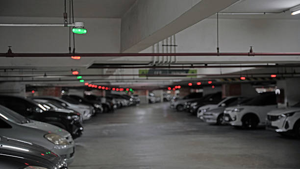 istock Smart public parking system. A system with green or red light that show if a car parking lot is empty or not. 2233525153