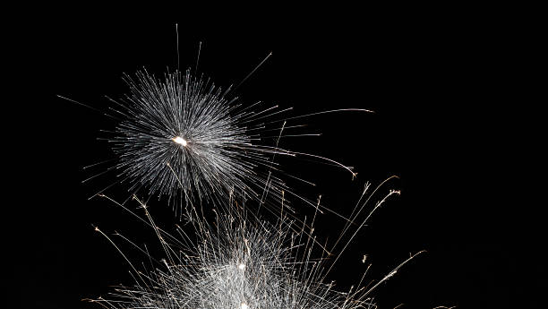 A fireworks sparkler photographed at night
