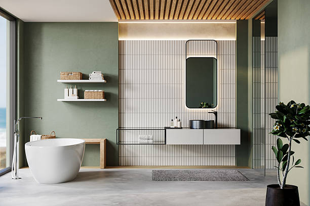 istock Modern minimalist bathroom interior with freestanding bathtub, vanity unit, mirror, shelves, and natural sunlight. Japandi-inspired cozy design with green accent wall, wooden ceiling, and elegant accessories. 3D render 2233526264