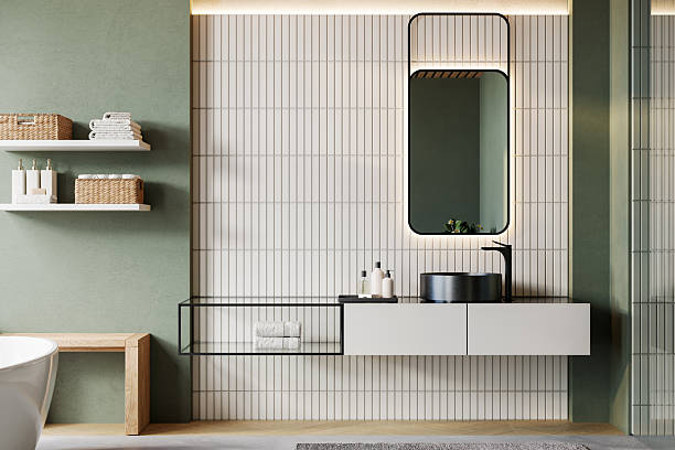 istock Modern minimalist bathroom interior with vanity unit, black basin, mirror, shelves, and cozy accessories. Japandi-inspired design with green accent wall, vertical white tiles, and natural light. 3D render. 2233526281